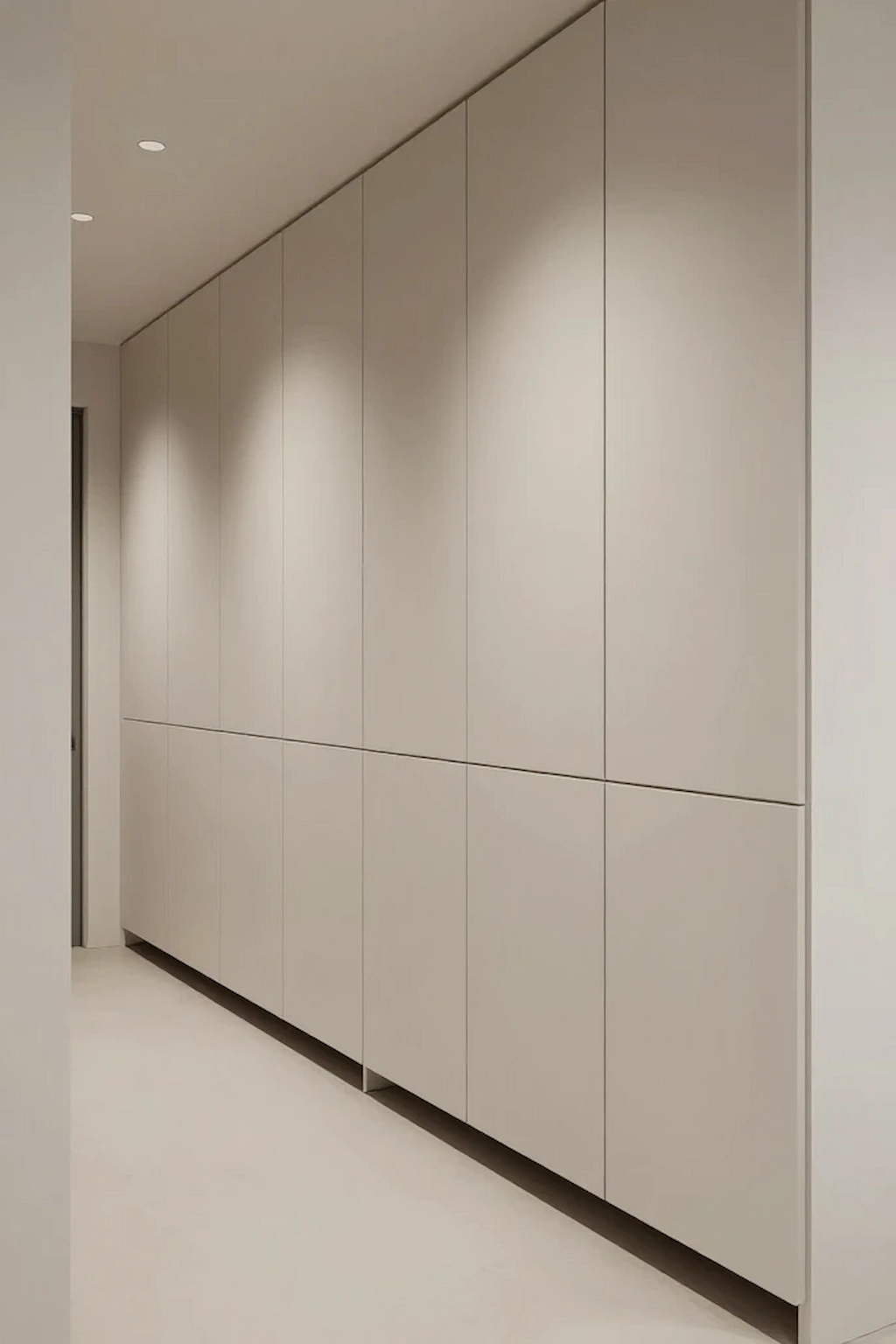 Hallway with tall storage cabinets and clean design