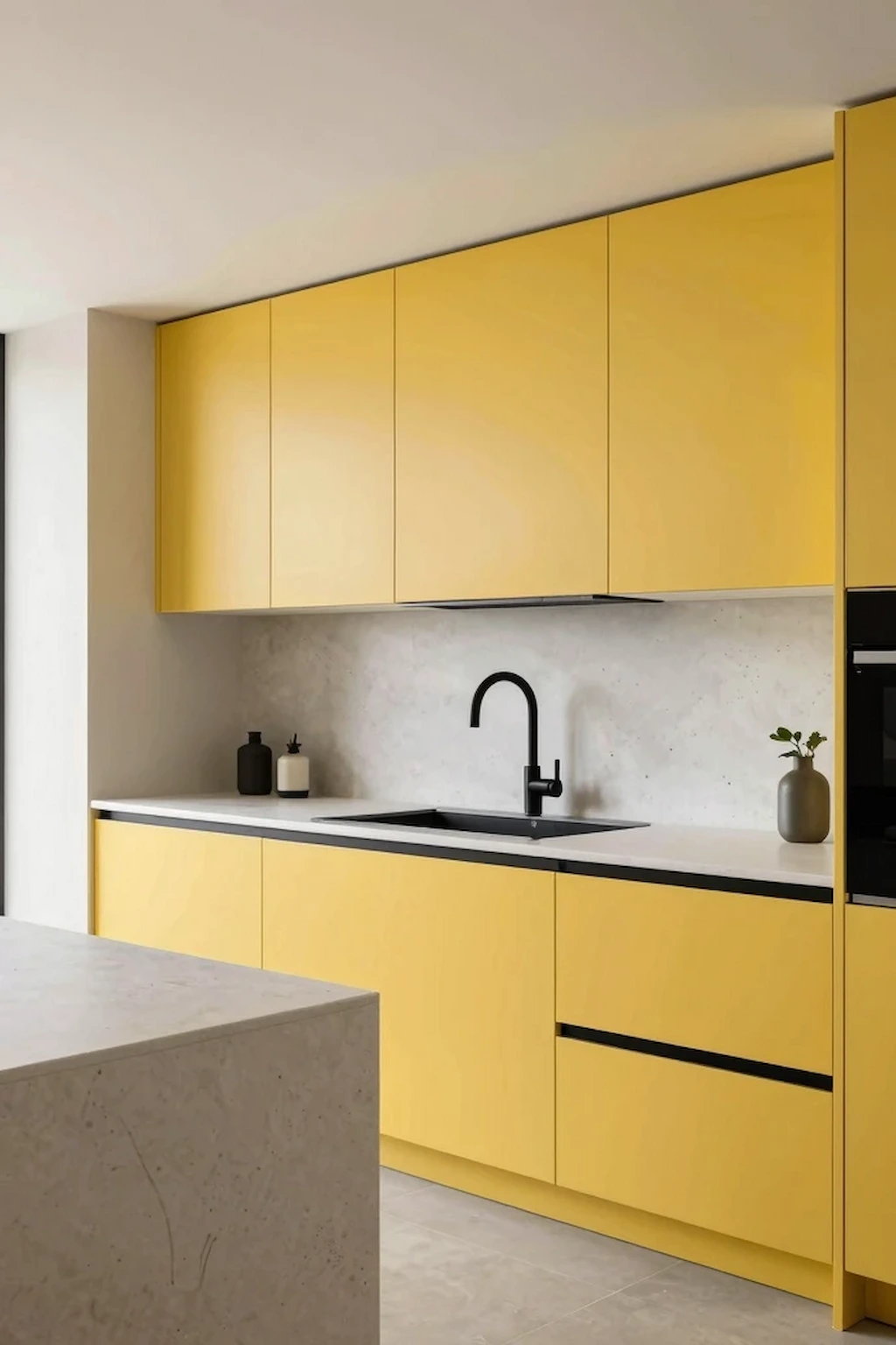 Contemporary kitchen with matte yellow cabinets, black hardware, and sleek modern design
