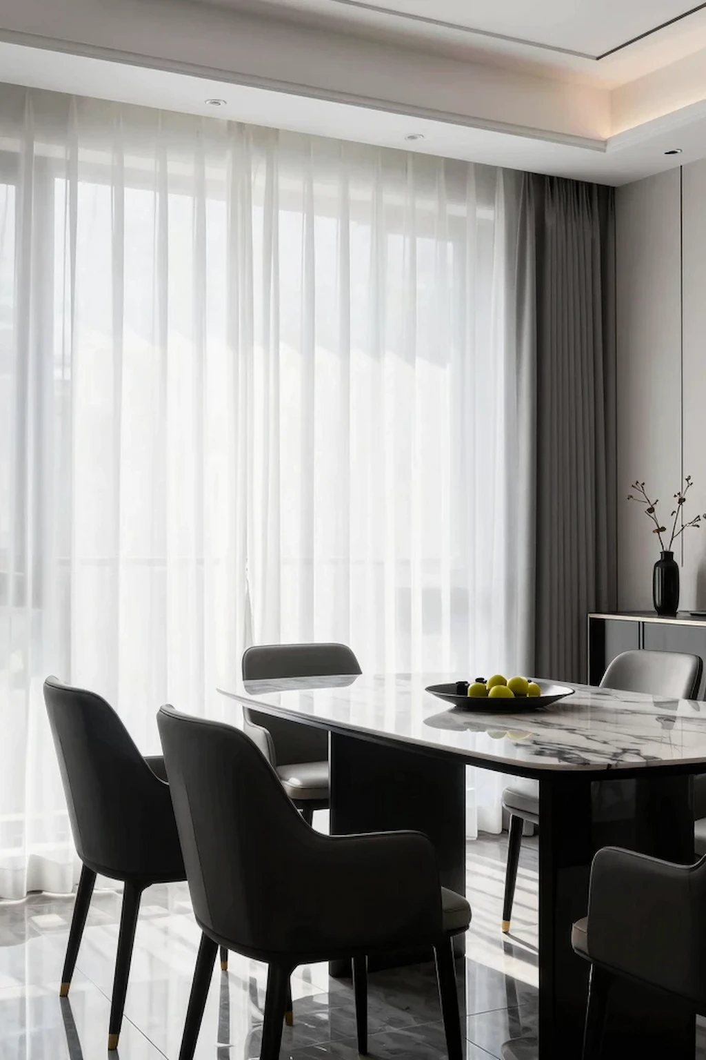 Dining room with white curtains and black furniture